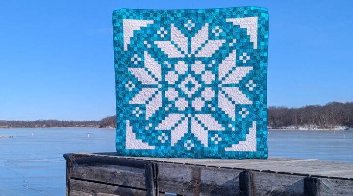 Early Bloomer pixel quilt made with solid turquoise fabrics and the Lights On II collection of white-on-white fabrics by Riley Blake Designs