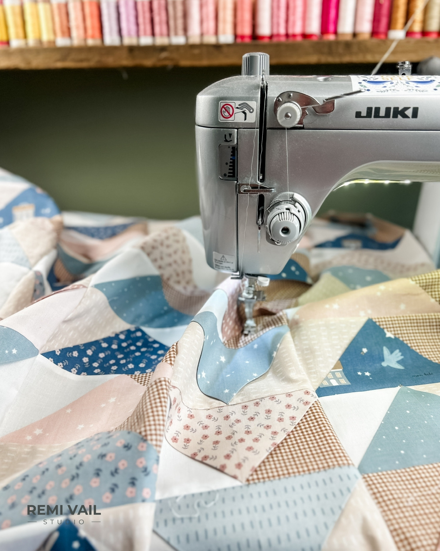 Juki sewing machine is being used to piece all the flying geese blocks into columns and rows.