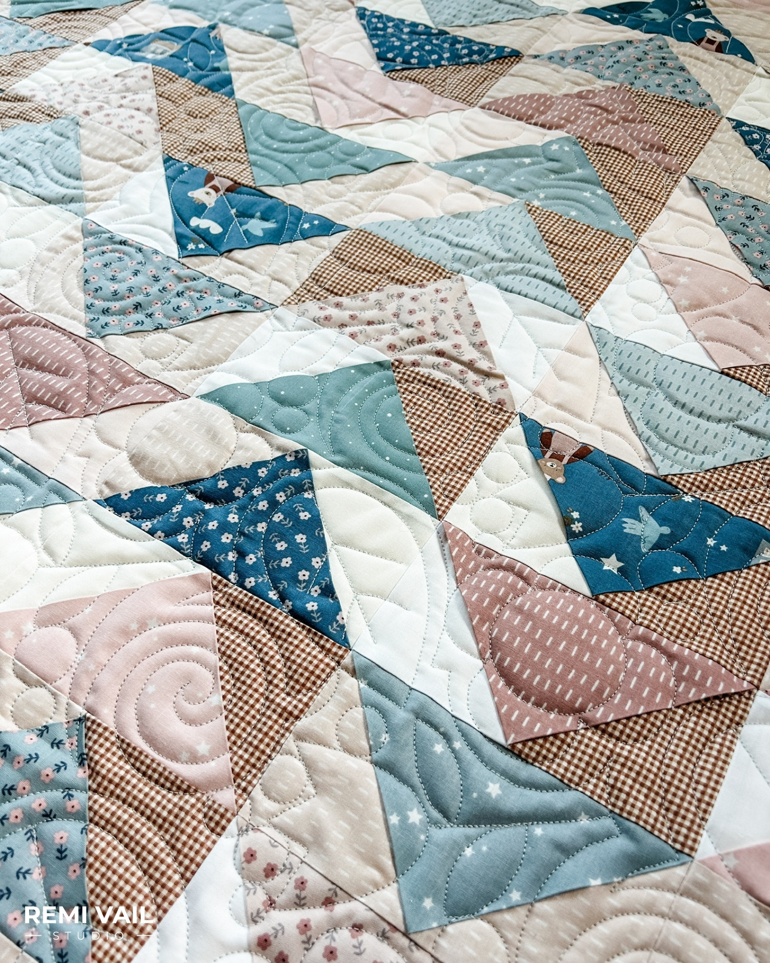Front Porch Quilt made by Remi Vail Studio using the Cozy Bebe fabric collection by Riley Blake Designs. Quilting is shown up close. Quilt design is Cottage Core by Sew Shabby Quilting.