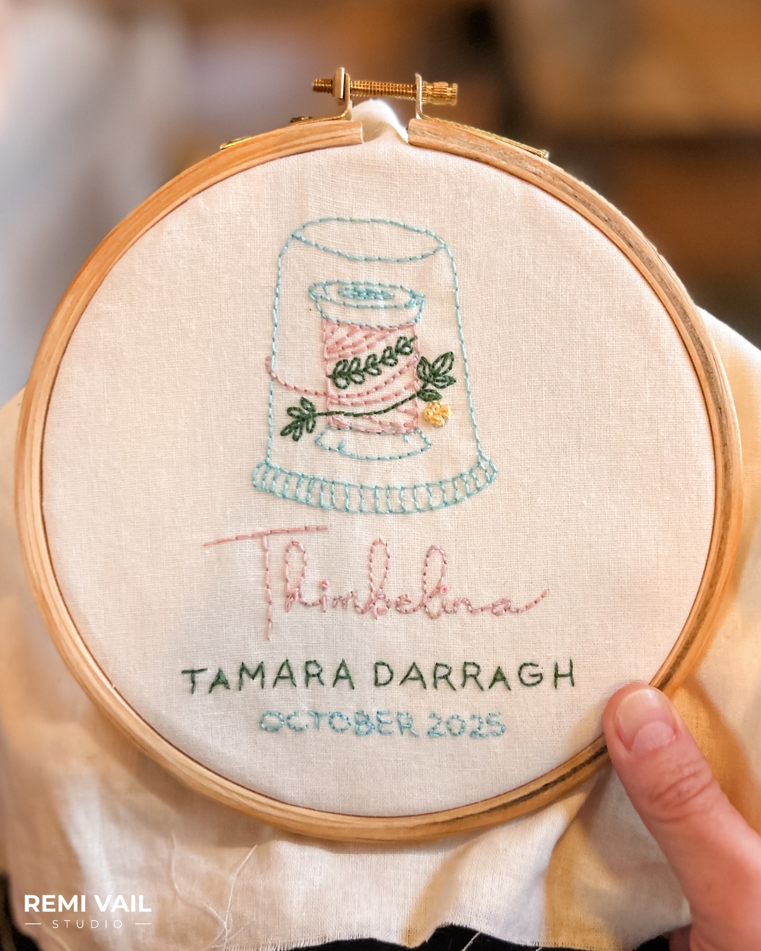 Hand Embroidered quilt label by Tamara Darragh for Remi Vail Studio using Aurifil Thread.