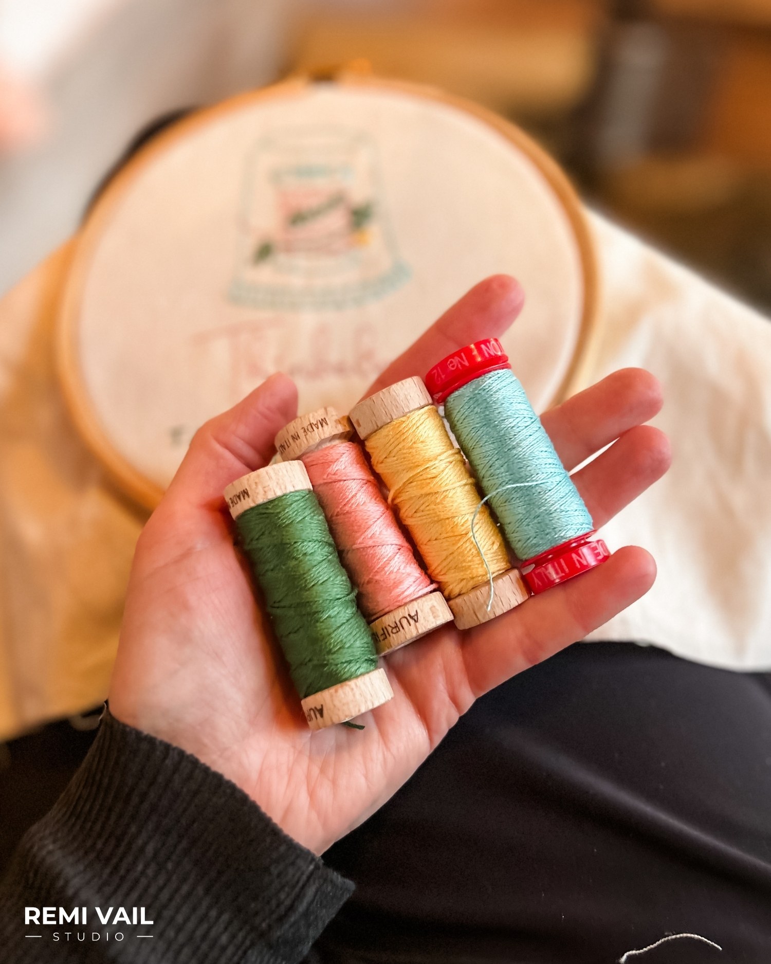 Hand Embroidered quilt label by Tamara Darragh for Remi Vail Studio using Aurifil Thread.