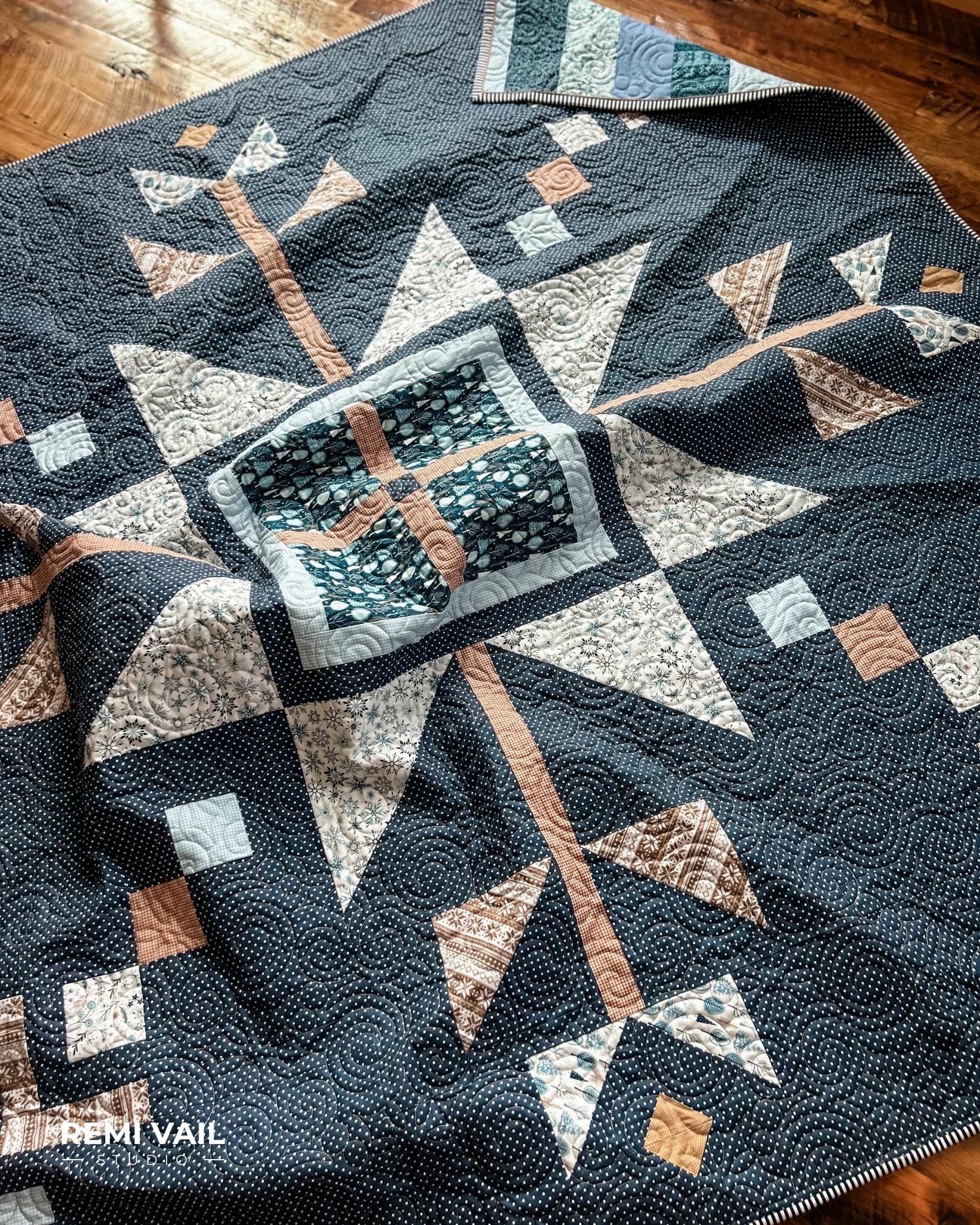 Lumi Quilt by Remi Vail Studio made by Tamara Darragh using the Winter Magic Fabric Collection designed by Dani Mogstad for Riley Blake Designs. 