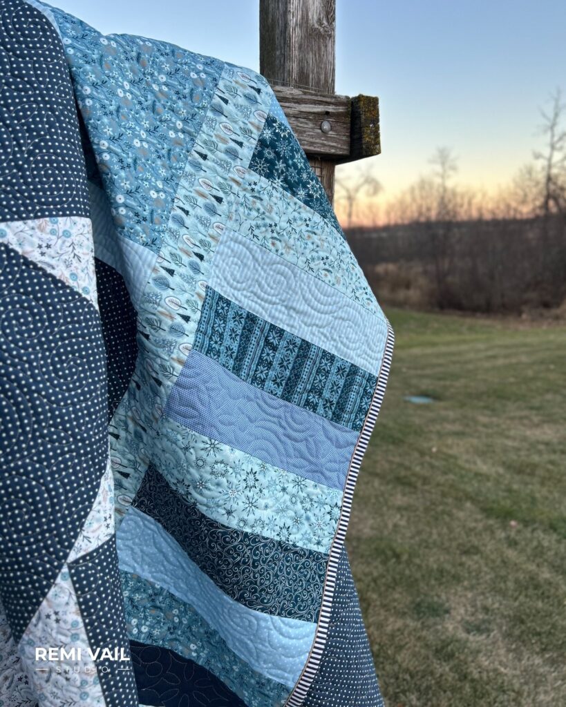 Lumi Quilt by Remi Vail Studio made by Tamara Darragh using the Winter Magic Fabric Collection designed by Dani Mogstad for Riley Blake Designs. 