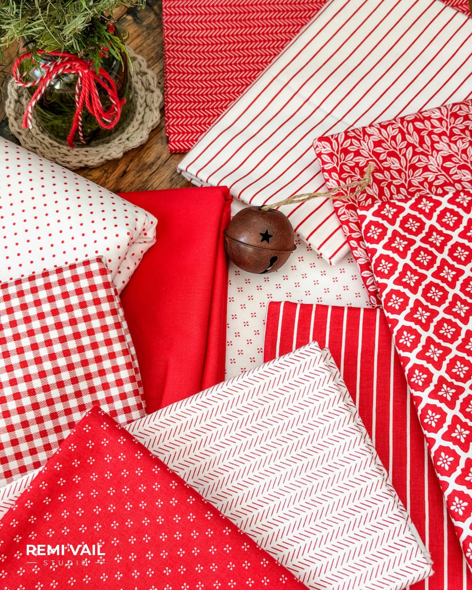 Radiant Ruby fabric collection by Riley Blake Designs arranged in red and white prints, used for the Lumi Quilt pattern by Tamara Darragh of Remi Vail Studio.